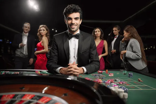 A glamorous woman holding casino chips in a neon-lit environment, representing the premium online casino atmosphere of 866JL.